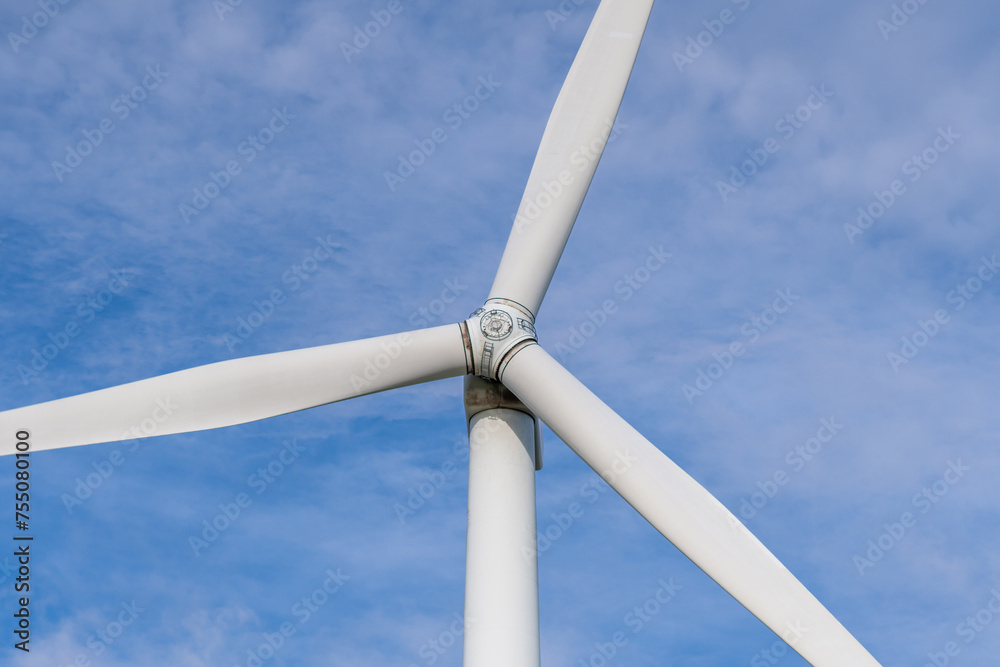 Windmill farm among fields and small trees. European Environment Initiative. Conservation of energy and fossil resources. Zero Ecological Footprint Windmill farm among fields and small trees. European Environment Initiative. Conservation of energy and fossil resources. Zero Ecological Footprint