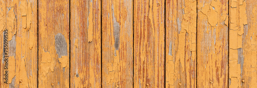 Backgroud of aged natural old wood yellow fence wall texture. Panoramic banner