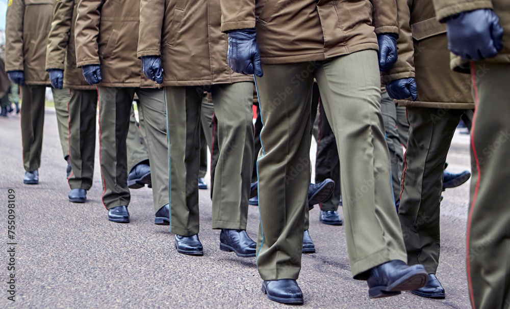 Army Soldiers in Uniform Marching in Formation on Parade Ground During Military Ceremony Army Soldiers in Uniform Marching in Formation on Parade Ground During Military Ceremony