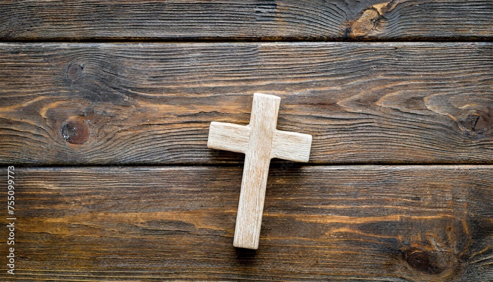 funeral concept wooden cross on dark wooden background top view copy space