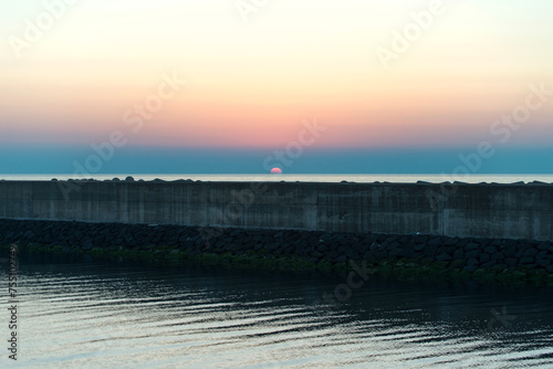 View of the sunset over the seawall