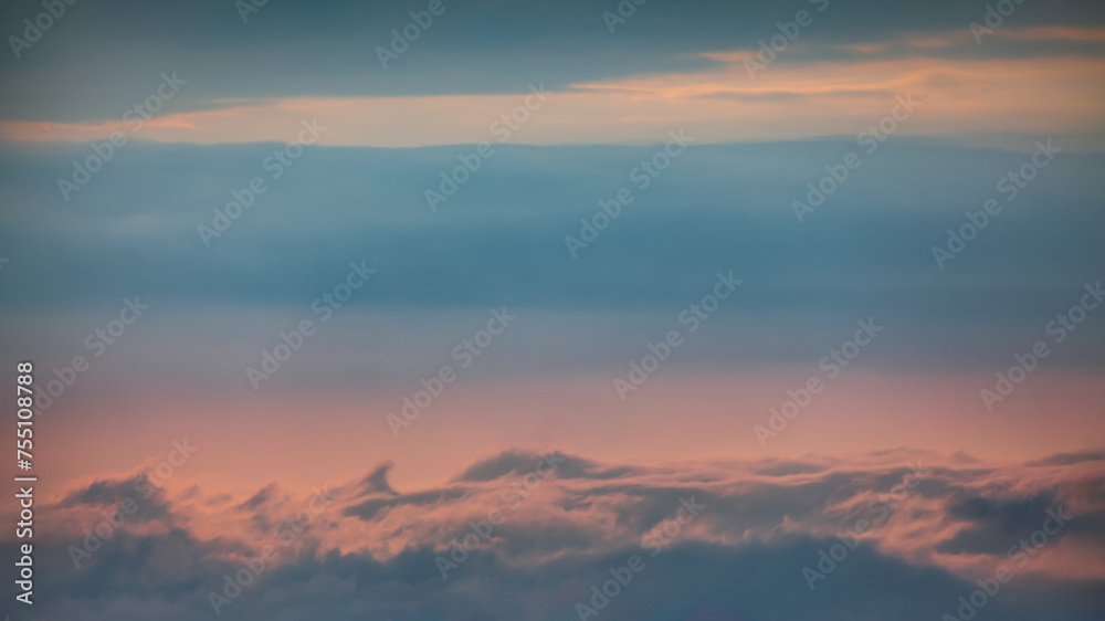 Romantic tranquil sky with clouds at beautiful sunset as natural background