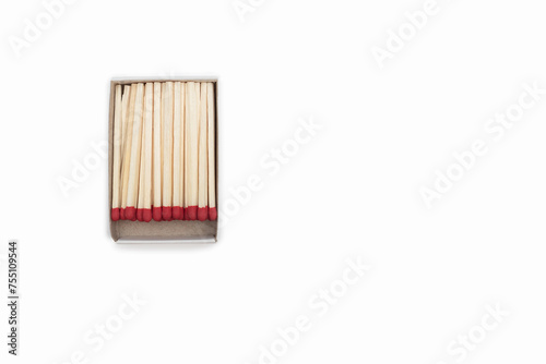Matches in an open matchbox on a white background. Top view of opened matchbox isolated on white background. Close-up with a blank space for your text