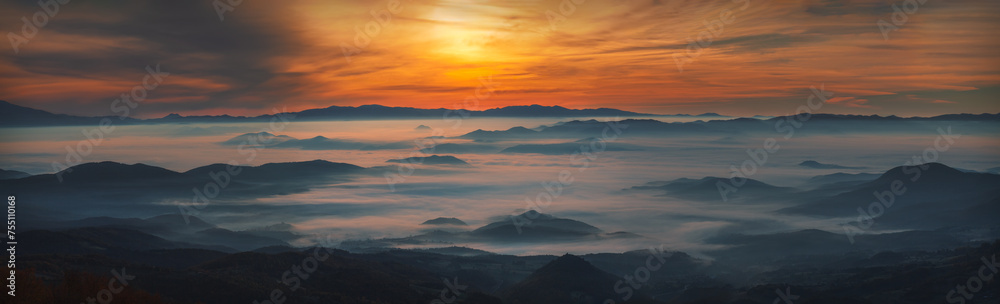 Weather temperature inversion on mountain at foggy dawn