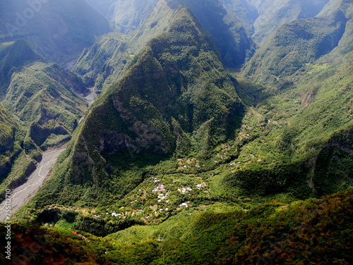 View of Grand Bassin ilet from the Tampon, Bois court viewpoint, La Réunion. Isolated village in the valley, surrounded by steep mountains