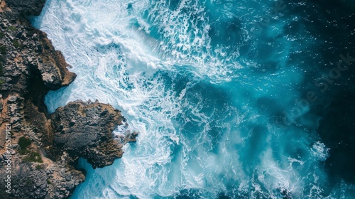 Aerial View of Ocean Waves Crashing on Rocks