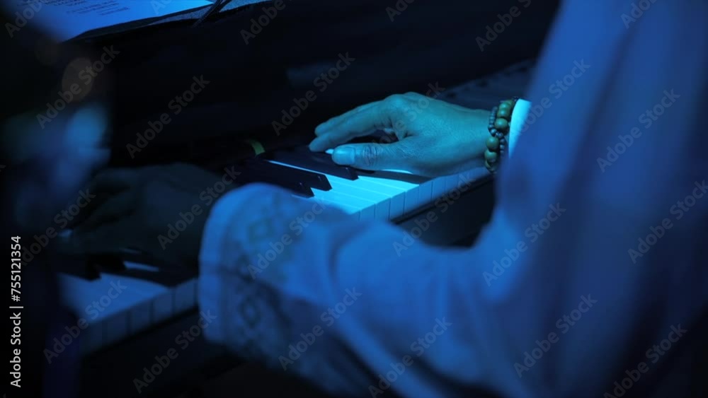 Black pianist playing on stage
