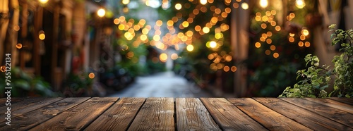 Rustic wooden tabletop with a dreamy blurred background of glowing string lights and green foliage, evoking a cozy evening ambiance.