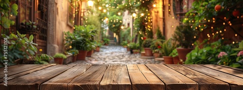 Antique wooden table in focus with a romantic alleyway and warm hanging lights blurred in the background  evoking an enchanting evening mood.