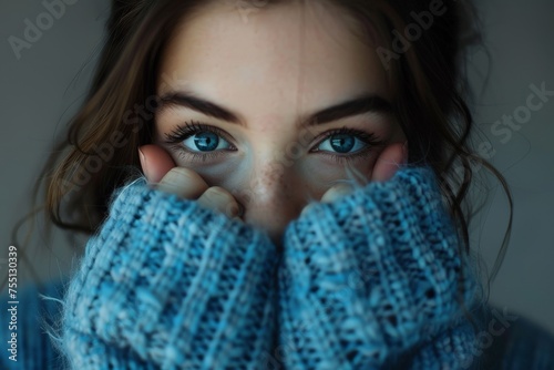 Woman With Blue Eyes Covering Face