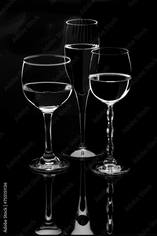 rim light on wine glasses on black background
