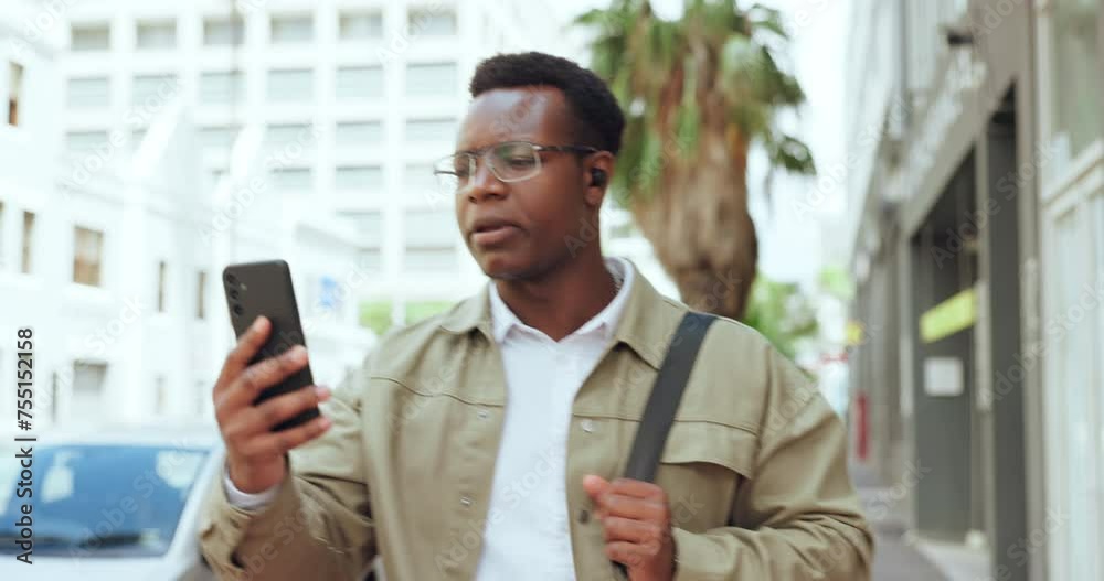 Business man, video call and talk in city with earphones, listen and conversation with mobile in road. Person, employee and smartphone with serious face, chat and contact on metro sidewalk in Kenya Business man, video call and talk in city with earphones, listen and conversation with mobile in road. Person, employee and smartphone with serious face, chat and contact on metro sidewalk in Kenya