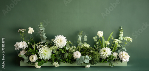 rectangular flower box with brassica,trachelium,dianthus,eucalyptus,lisianthus,sedum,dahlia,white-green scale,on a textured green background,copy space,floristry concept,gardening,landscape design, photo