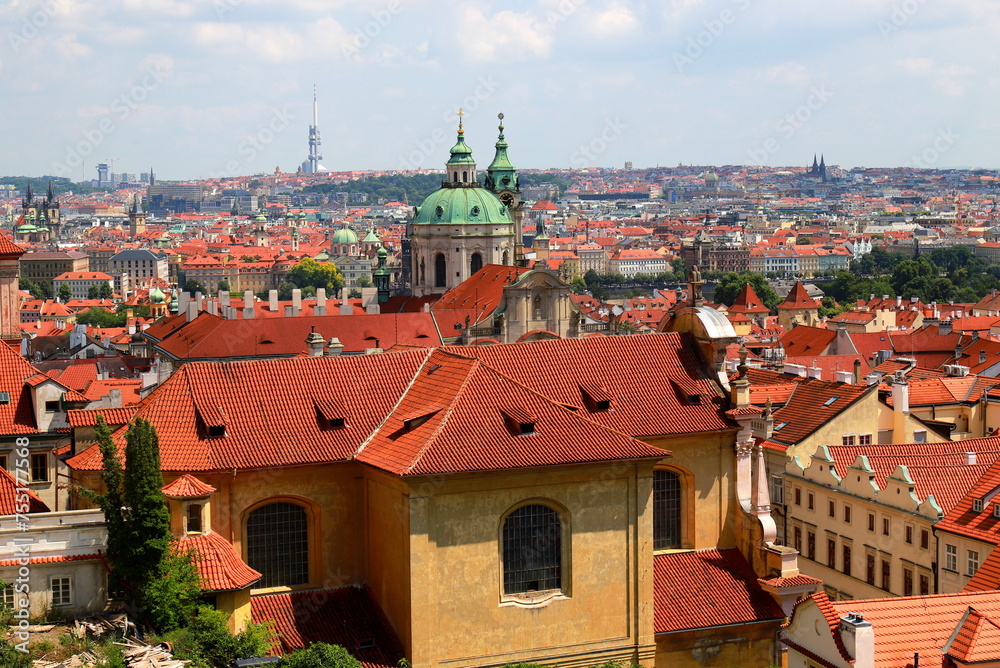 Prague, Czech Republic. Mala Strana, Old Town of Prague. Top view panorama. Ancient old buildings with red tiled roofs, church, tower, castle
