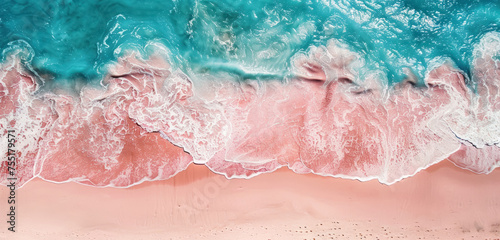 aerial view of turquoise waves crashing on pink sandy beach