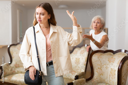 Slika na platnu Domestic quarrel between elderly mother and adult daughter in the living room