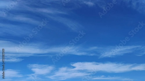 Blue sky full of large cirrus clouds in the morning photo