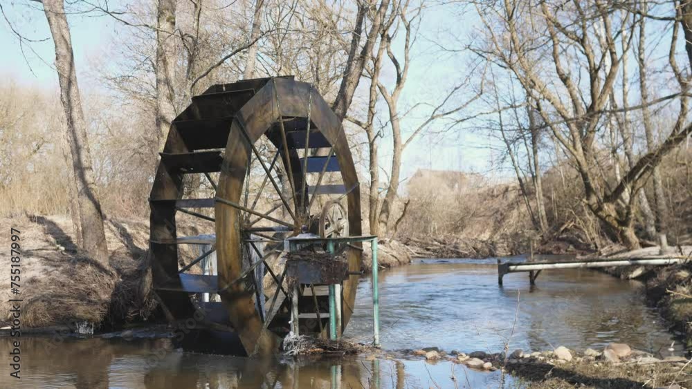 Old river power generator on a forest river Old river power generator on a forest river