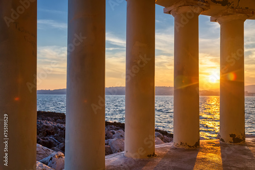 Landmark of Saint Theodore lighthouse in city of Argostoli at sunset, Kefalonia island, Greece