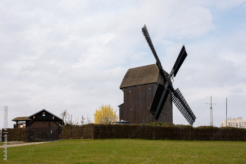 An old windmill located in the city of Berlin. Windmill close-up. An old windmill located in the city of Berlin. Windmill close-up.