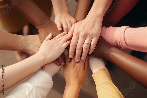 group of people put hands together