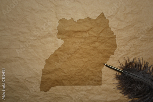 map of uganda on a old paper background with old pen