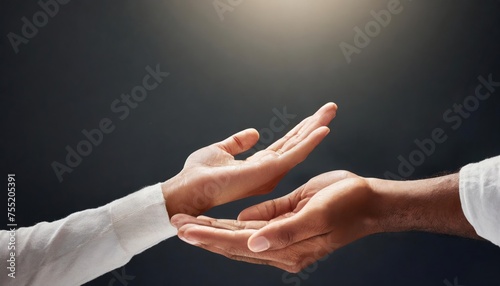 Hands, help and person reaching in studio for hope, charity or guidance, care or trust on dark background space. Palm, offer and model with mockup for donation, safety or assistance, guide or support photo