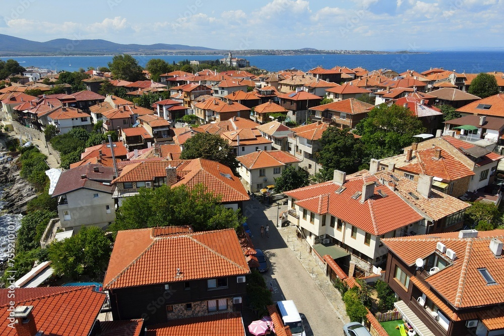 Historic old houses with red tiled roofs, architecture on Black Sea coast. Old town of Nessebar, Bulgaria, Panorama. Beautiful and colorful amazing city
