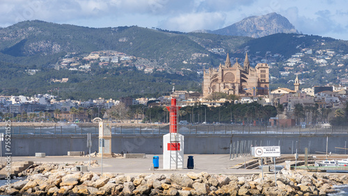 Majestic Cathedral of Palma Framed by Lush Hills and a Marina Beacon, Mallorca