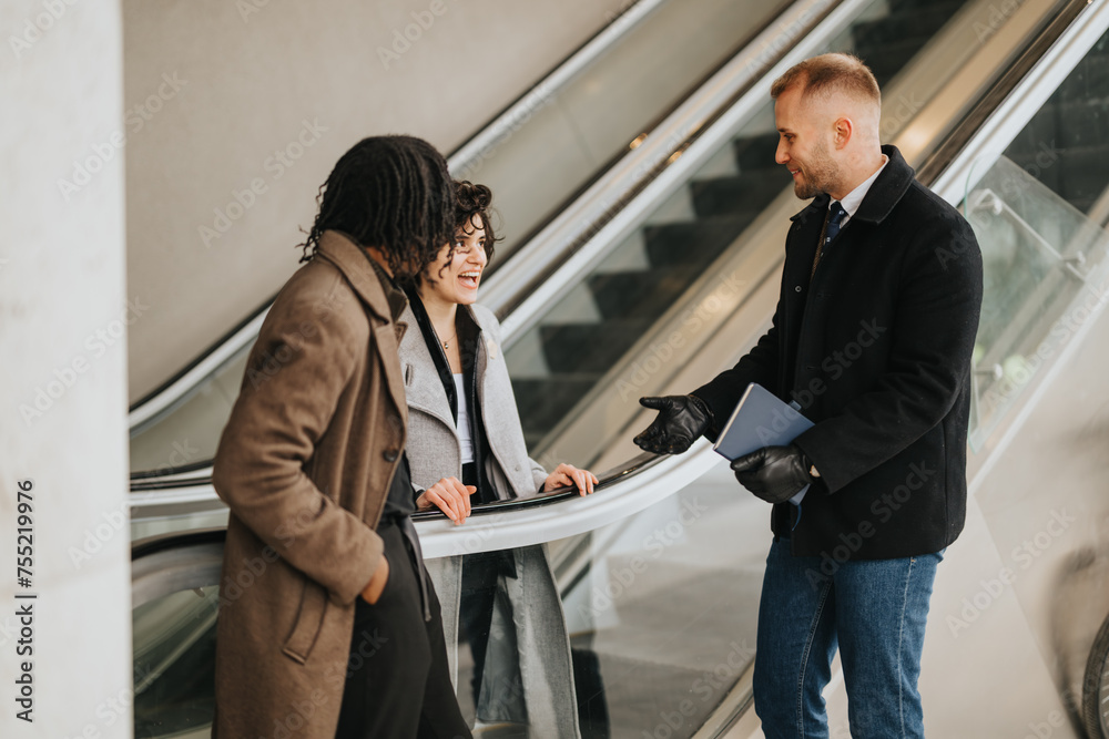 Multiracial business colleagues engaging in a friendly conversation on escalator. Multiracial business colleagues engaging in a friendly conversation on escalator.