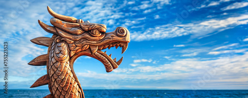 Dragon figurehead on a Viking longship, ocean background, copyspace, wide banner