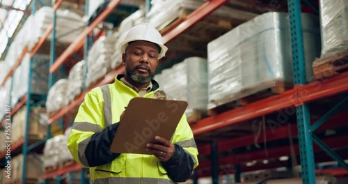 Manufacturing, warehouse and black man with clipboard for inspection, inventory and check stock. Shipping, distribution and person writing notes for logistics, maintenance and checklist in factory photo