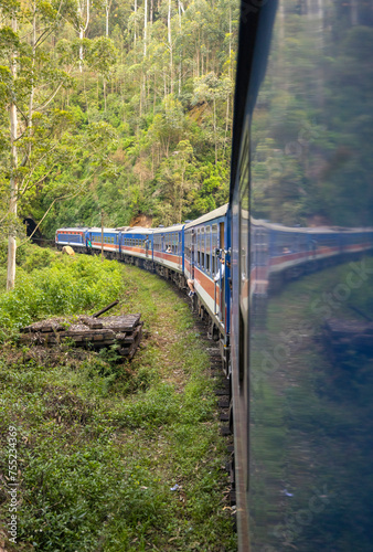 Reflection of the train from Kandy to Ella from the doorway while passing through a tunnel, Central Province of Sri Lanka