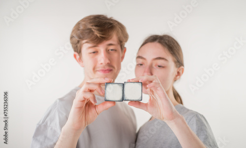 hands with empty cubes. couple showing empty cubes with free space for logo text