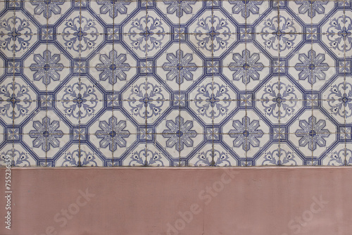 Blue traditional Portuguese ceramic tiles pattern, azulejos. Beautiful shabby dirty pink facade, wall banner. Old Lisbon building decoration Portugal decorative background with geometric stars