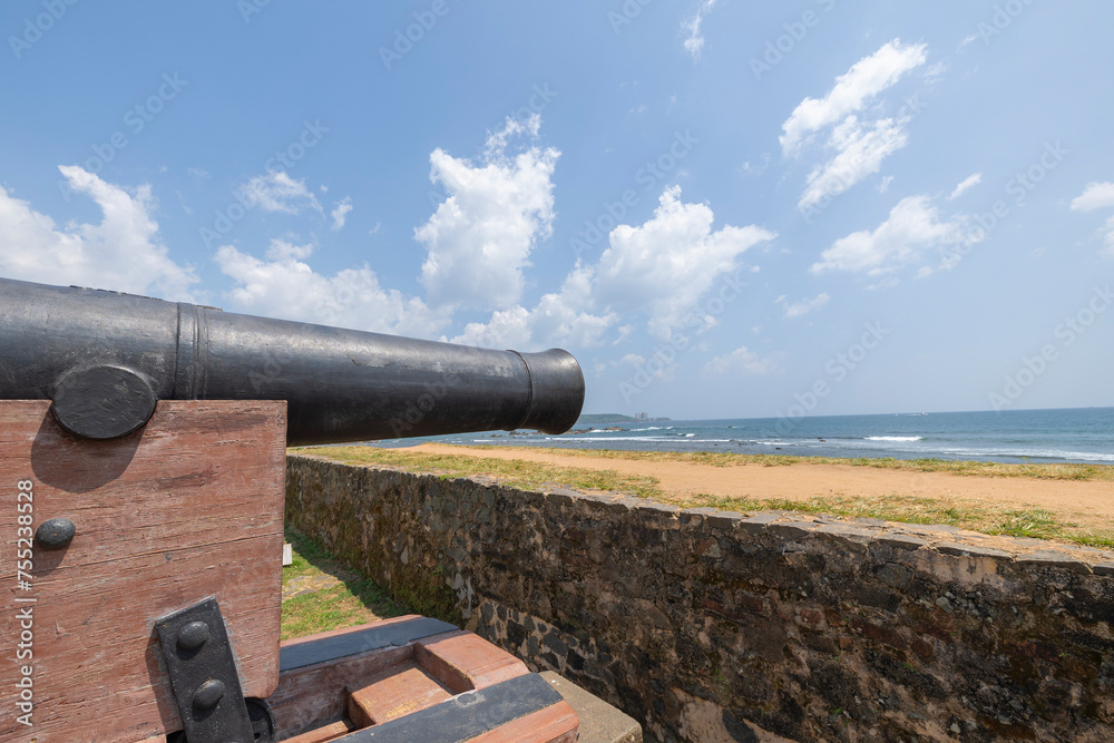Old colonial artillery cannons on bastion along the coast line of Galle, Southern Province of Sri Lanka Old colonial artillery cannons on bastion along the coast line of Galle, Southern Province of Sri Lanka