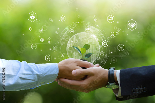 Environment Earth Day Concept. Businessman hands holding small plants with ESG icons Idea for Saving the environment and environmentally sustainable. Save Earth. Environment World Earth Day.CSR. photo