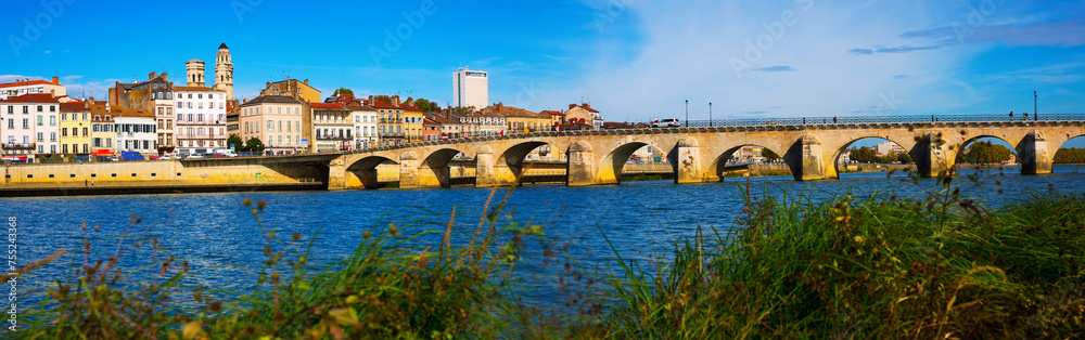 Old arch Saint-Laurent bridge over river in Macon, France