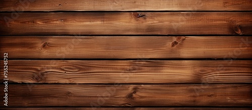 A wooden wall constructed by assembling planks and boards together in a sturdy manner. The wall showcases the craftsmanship involved in creating a structure using wooden materials.