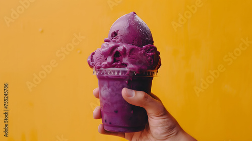 A hand holding a cup of acai cream. Isolated on a yellow background. Generative AI. photo