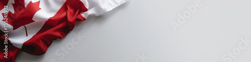 Canadian flag draped to one side against a clean white background.