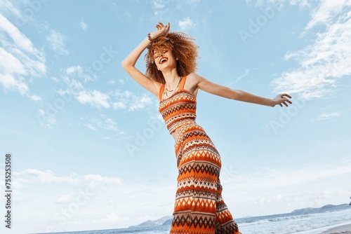 Summer Bliss: A Young, Beautiful Woman with Flowing Hair Standing on a Tropical Beach, Enjoying the Sun and Ocean View.