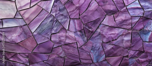 A detailed view of a wall constructed entirely of vibrant purple rocks, showcasing their unique texture and color contrasts.