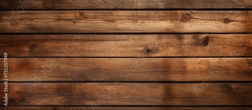 A wooden wall painted in a rich brown color, showing the texture and grains of the wood planks. The paint is even and smooth, with a matte finish.