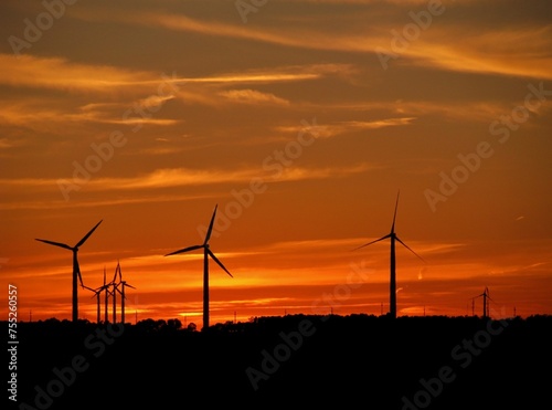 wind turbines at sunset