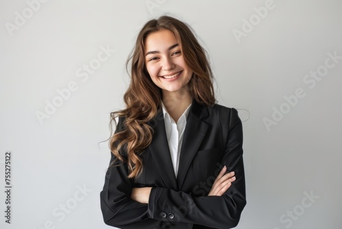 A successful business woman looks confident and smiles on white background