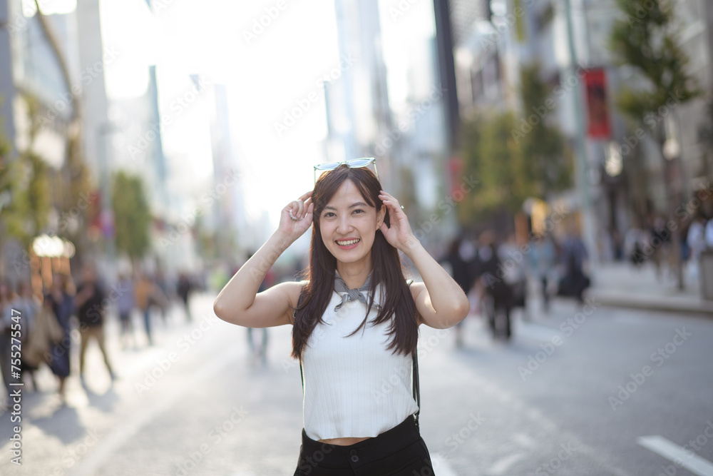 Experience the joy of city life through the eyes of a vibrant Asian woman, a perfect mix of style, confidence, and happiness. Experience the joy of city life through the eyes of a vibrant Asian woman, a perfect mix of style, confidence, and happiness.