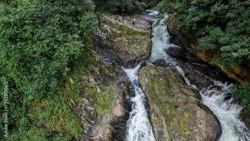 landscape of a huge waterfall in the middle of the jungle of Costa Rica surrounded by vegetation in the Barbilla National Park in indigenous territory