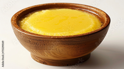 A bowl filled with golden ghee a staple in Ayurvedic detox diets that promotes healthy digestion and detoxification.