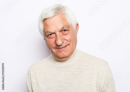 lifestyle, emotion and old people concept: portrait of happy senior man over white background © Raisa Kanareva